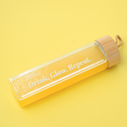 Green Goddess drikkeflaske med teksten Drink. Glow. Repeat.